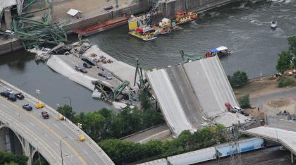 An aerial view shows the collapsed I-35W bridge 04 August 2007 in Minneapolis, Minnesota. Five people have been confirmed dead and 8 others missing following the 01 August bridge collapse during rush hour. AFP PHOTO/Mandel NGAN (Photo credit should read MANDEL NGAN/AFP/Getty Images)